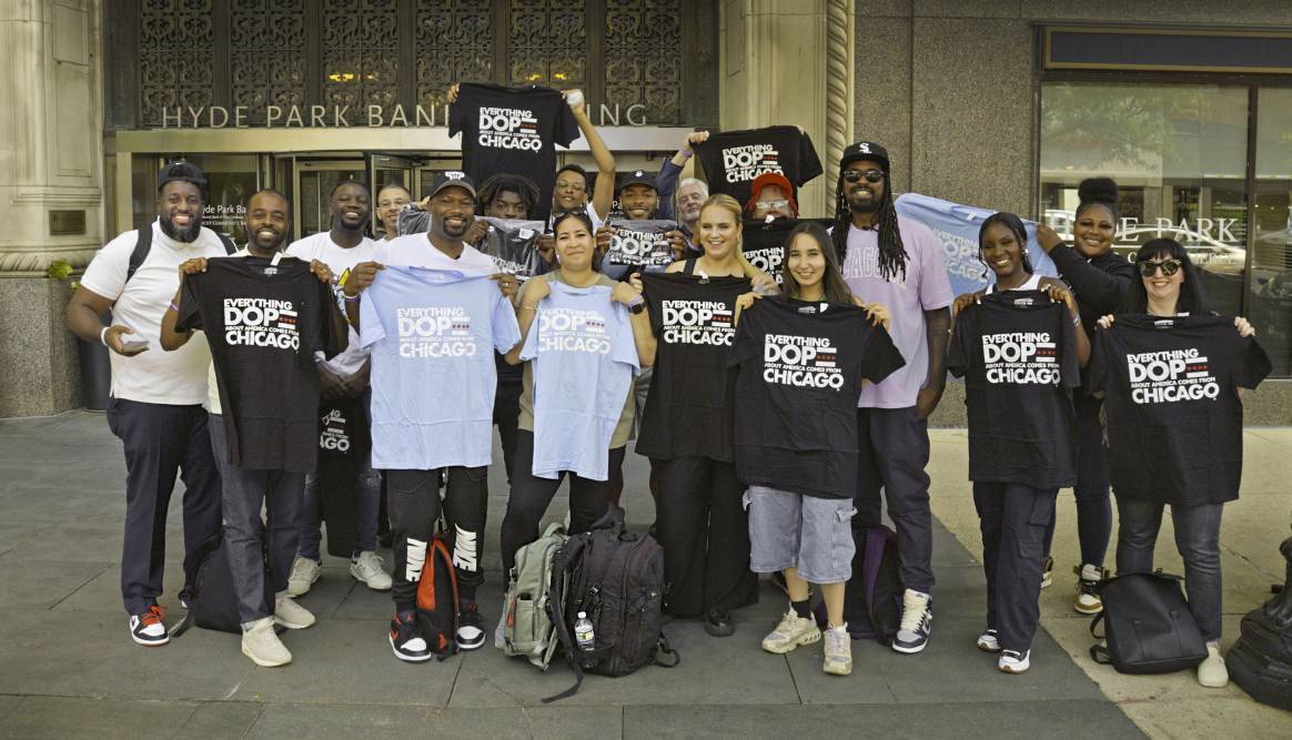 Students from London and Chicago all stand and smile together